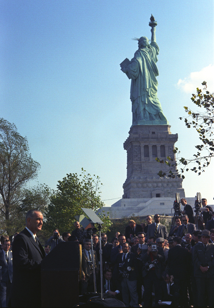 President Lyndon Johnson visits the Statue of Liberty to sign the Immigration and Nationality Act of 1965